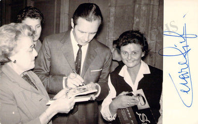 Signing autographs for fans