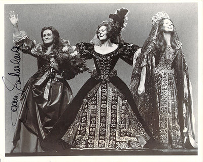 In three costumes
